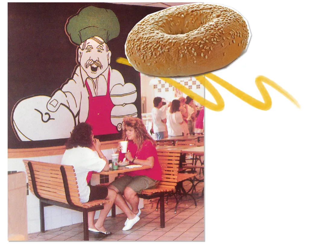 two students sit at booth at The Bagel Place