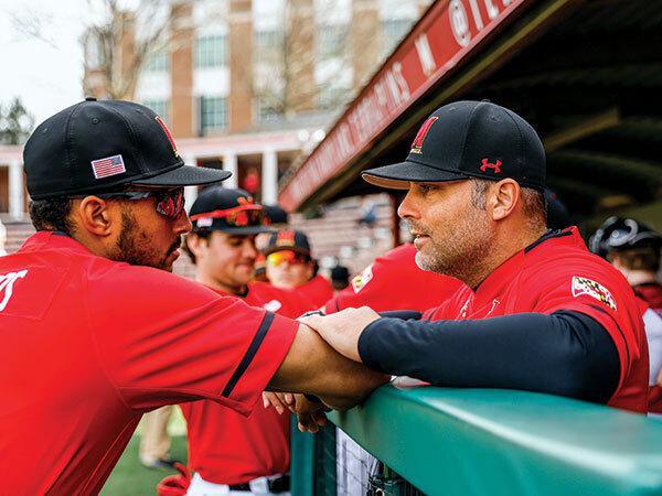 Swope talks to player in dugout