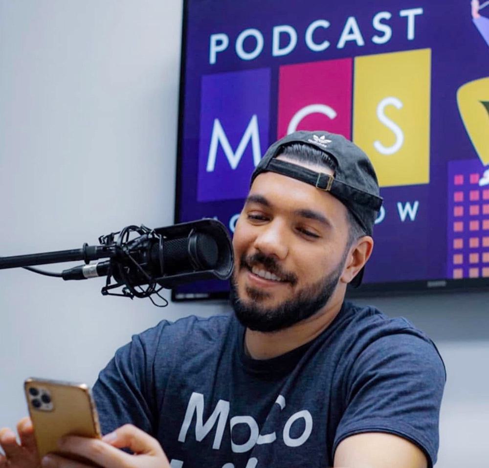 Alex Tsironis talks into microphone