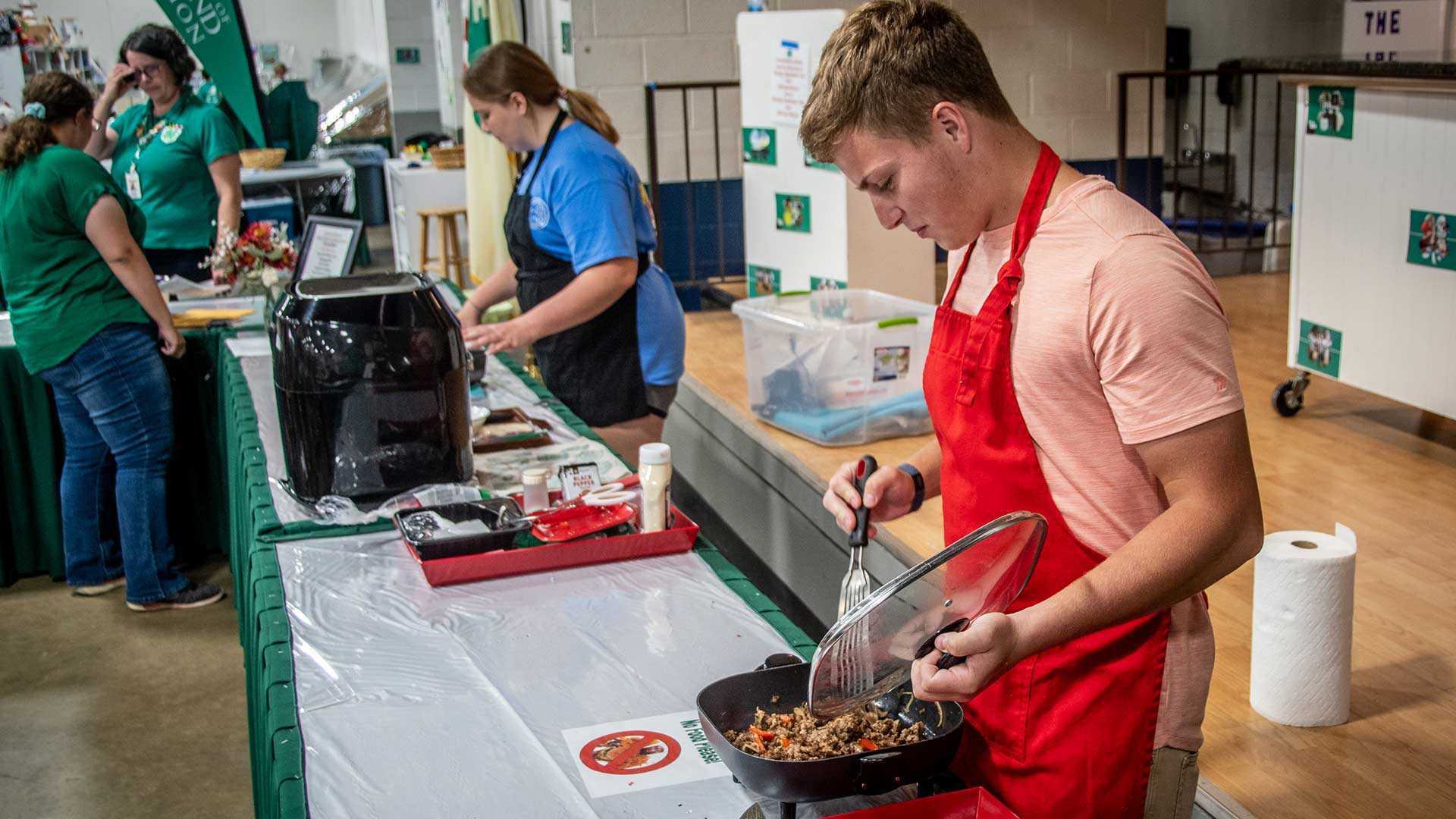 chefs wearing aprons cook