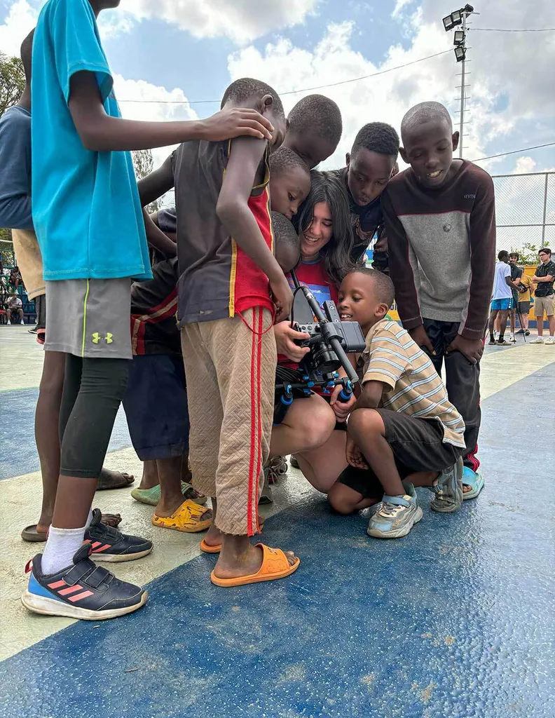 student shows boys pictures on camera