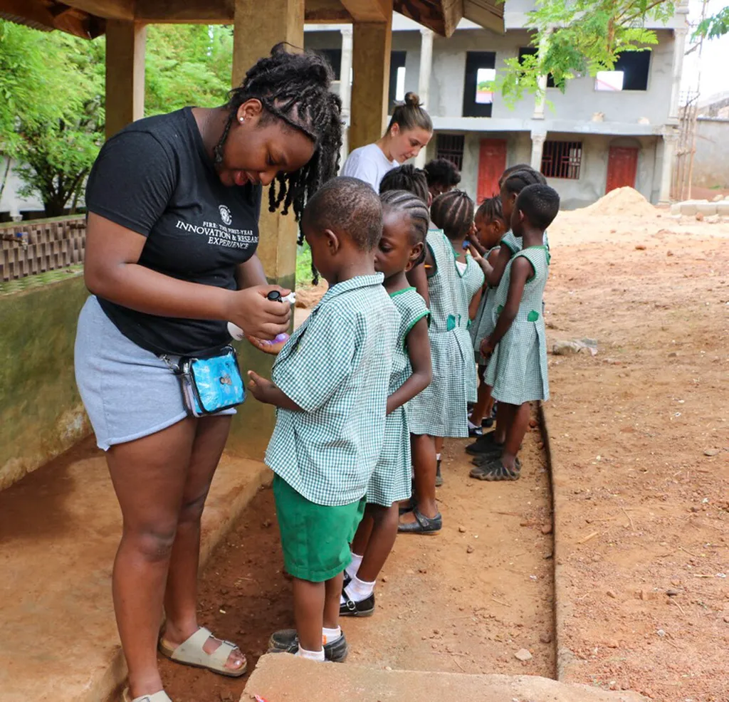 students teach kids about handwashing