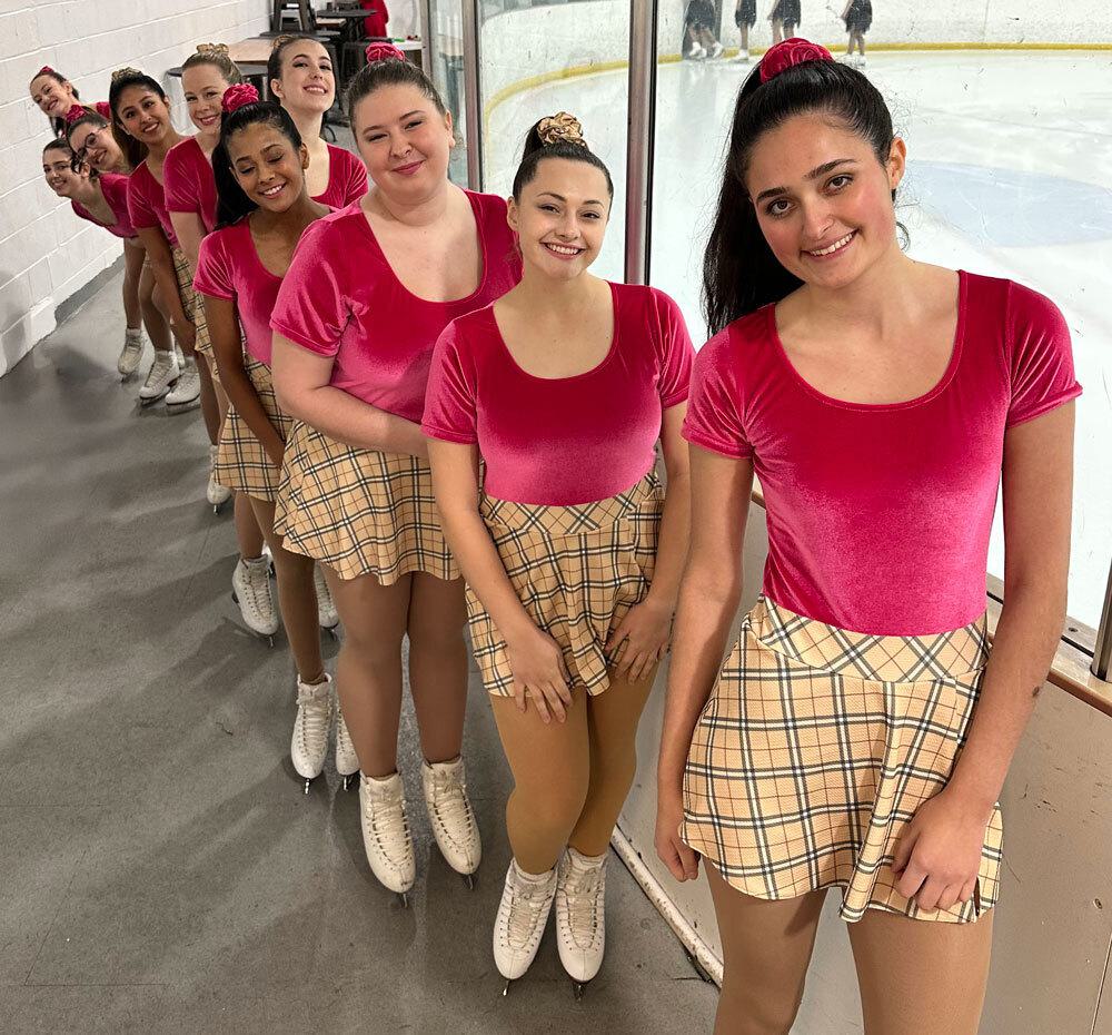Maryland synchronized skaters in pink tops and plaid skirts