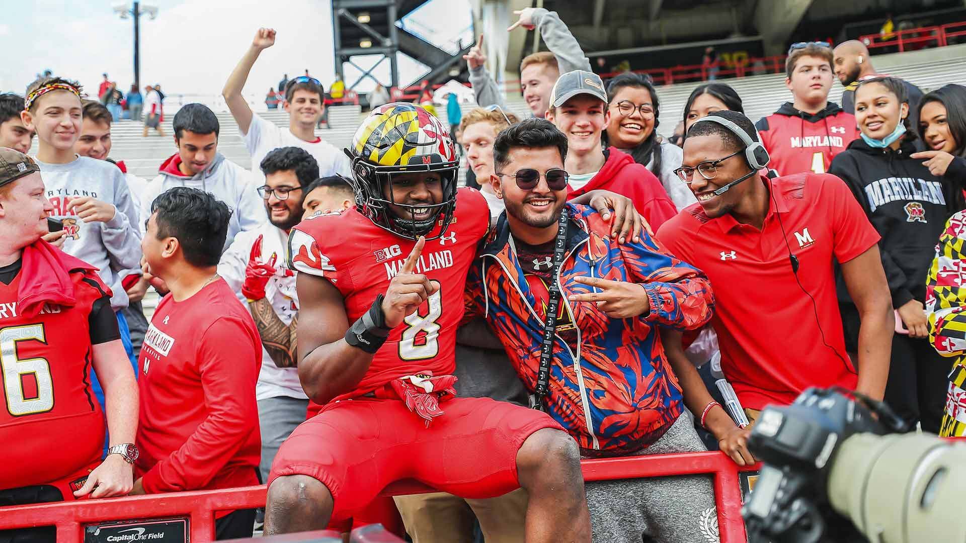 Running back Tayon Fleet-Davis poses with hyped-up Terp fans