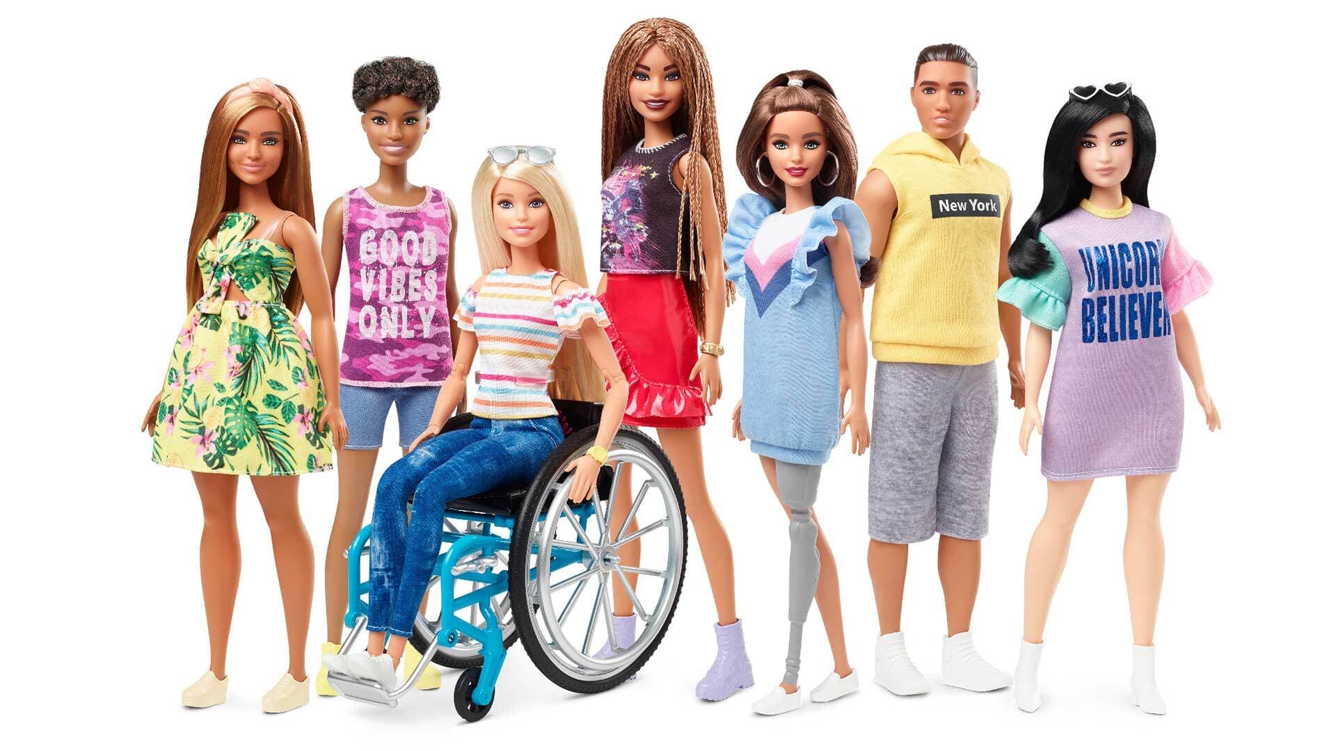 seven diverse Barbie dolls, including one in a wheelchair and one with a prosthetic leg