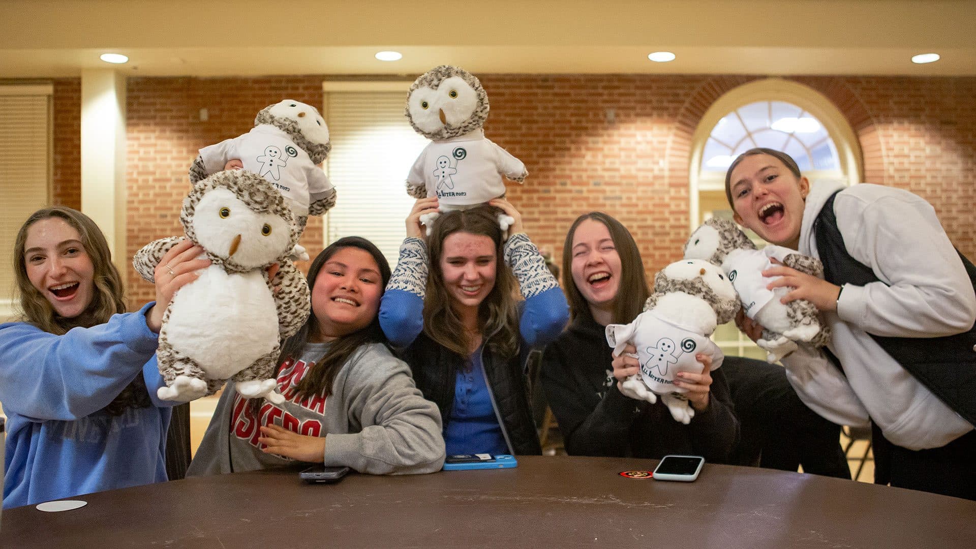 students show stuffed animals they constructed