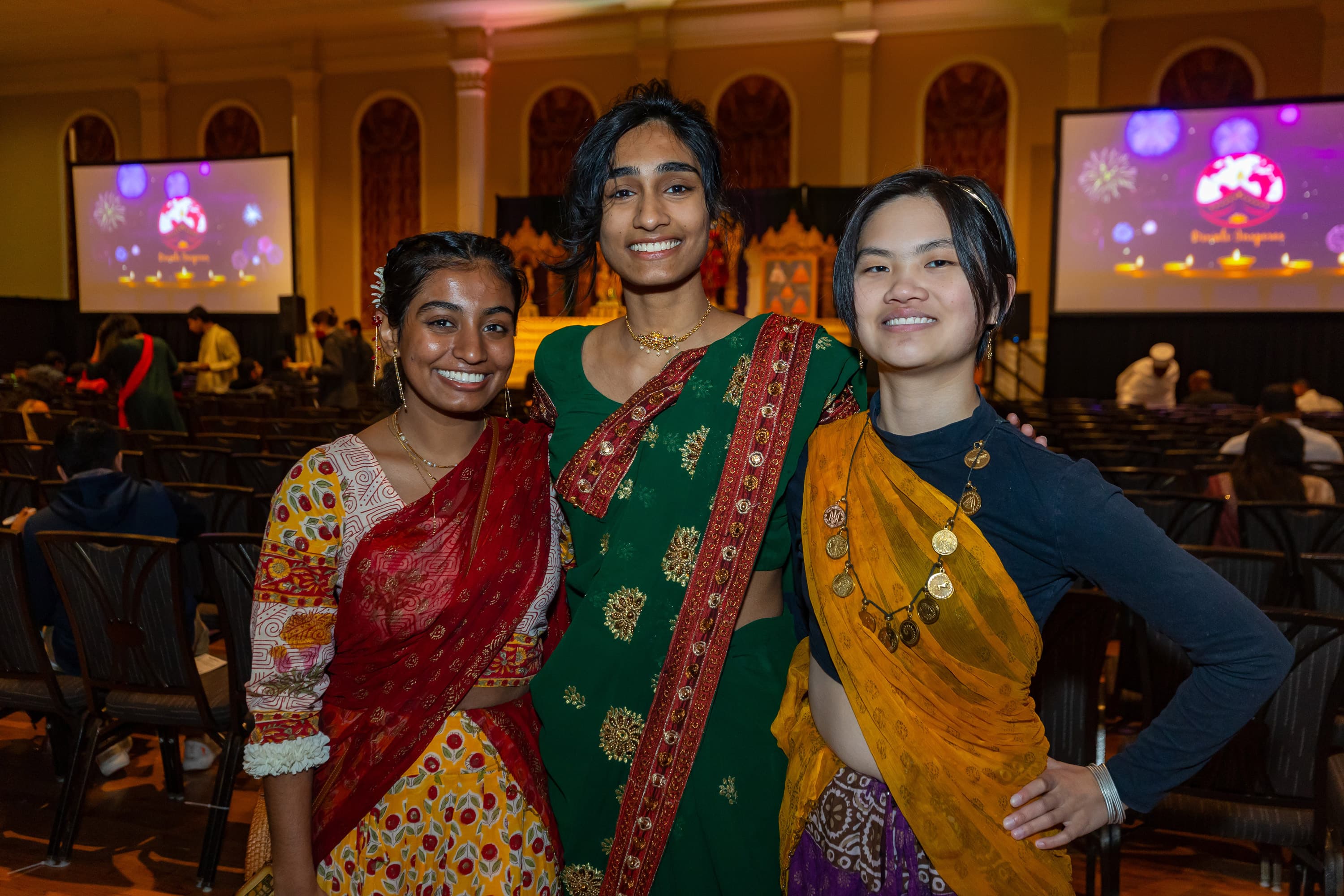 Three women in traditional Indian clothing