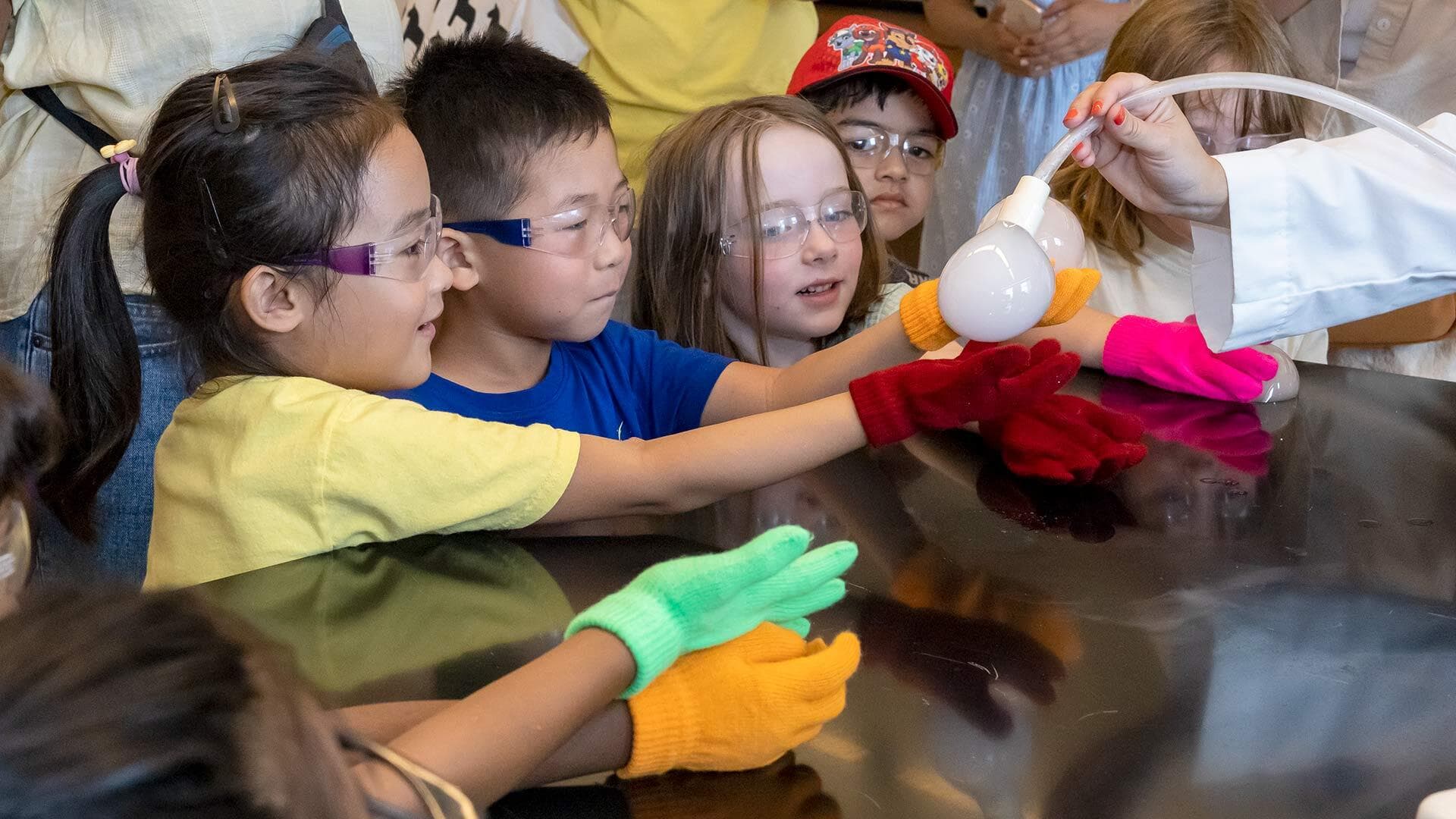 young students wear goggles for science demonstration