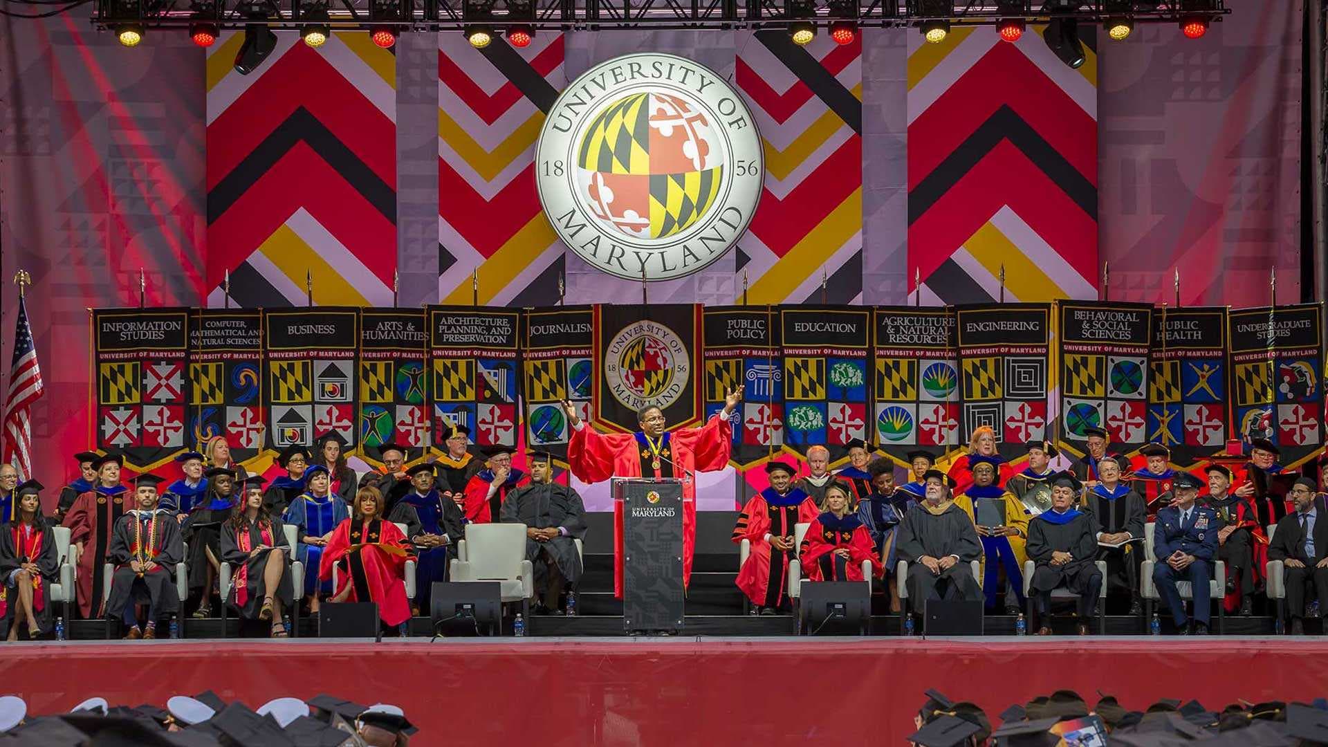 President Pines speaks on stage at Commencement