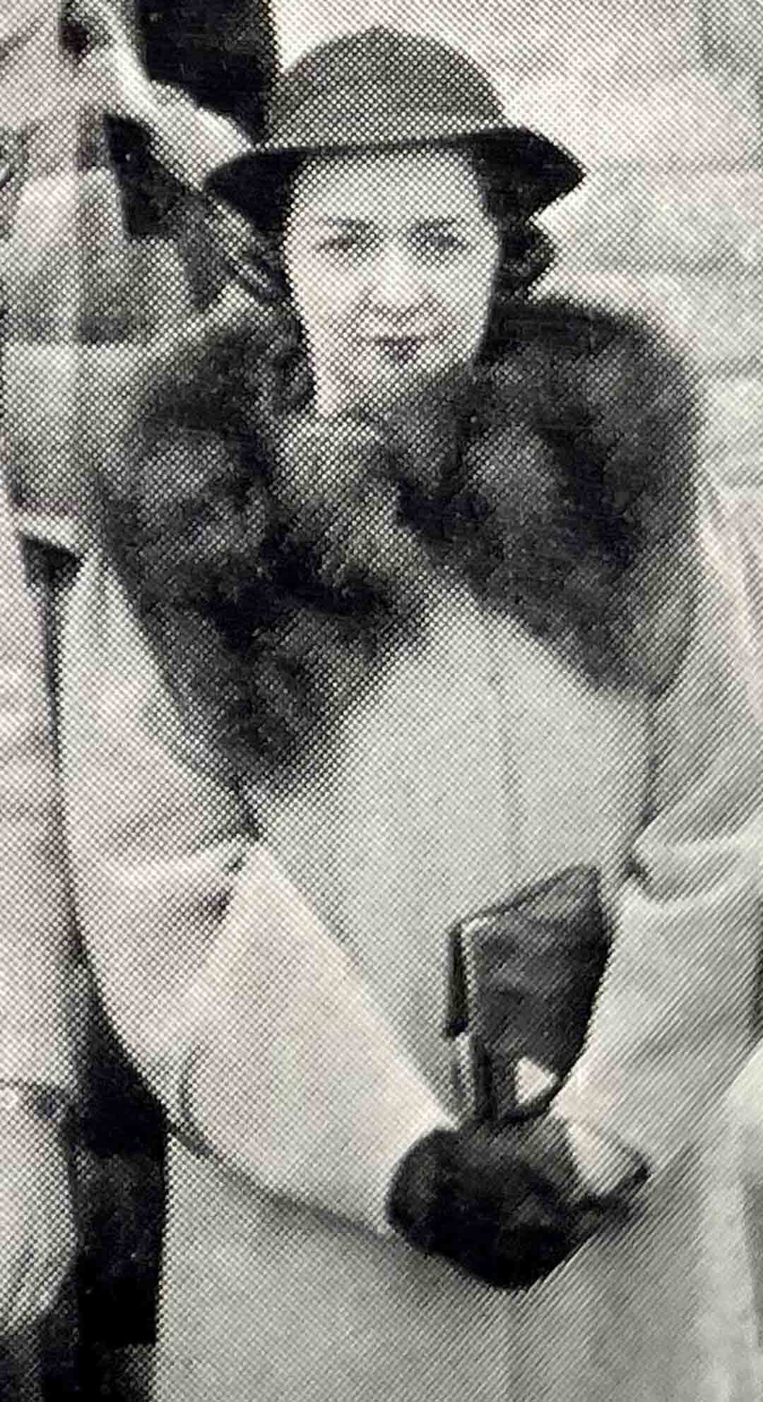 Black and white photo of young Janet Crampton wearing a fur coat and hat