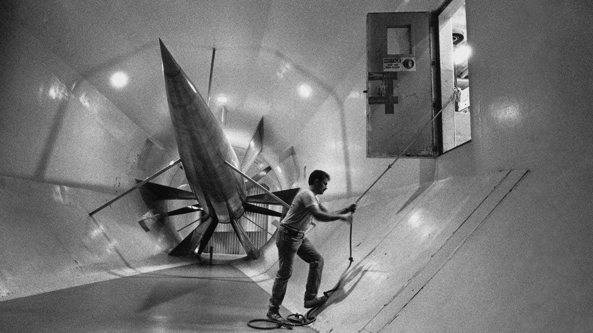 Dennis Loveless a senior Aerospace major climbs out of a wind tunnel date unknown 1920x1080