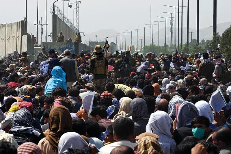 crowd waits outside Kabul International Airport