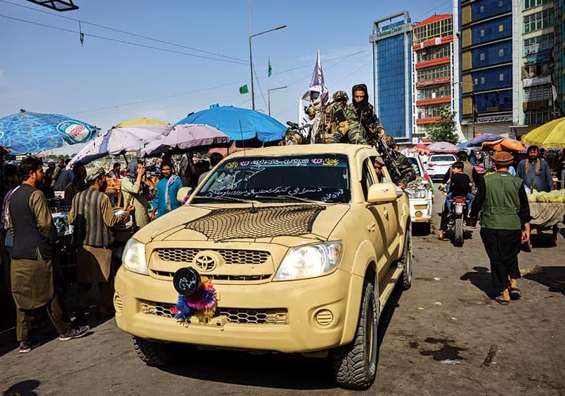 A Taliban patrol rolls through Kabul