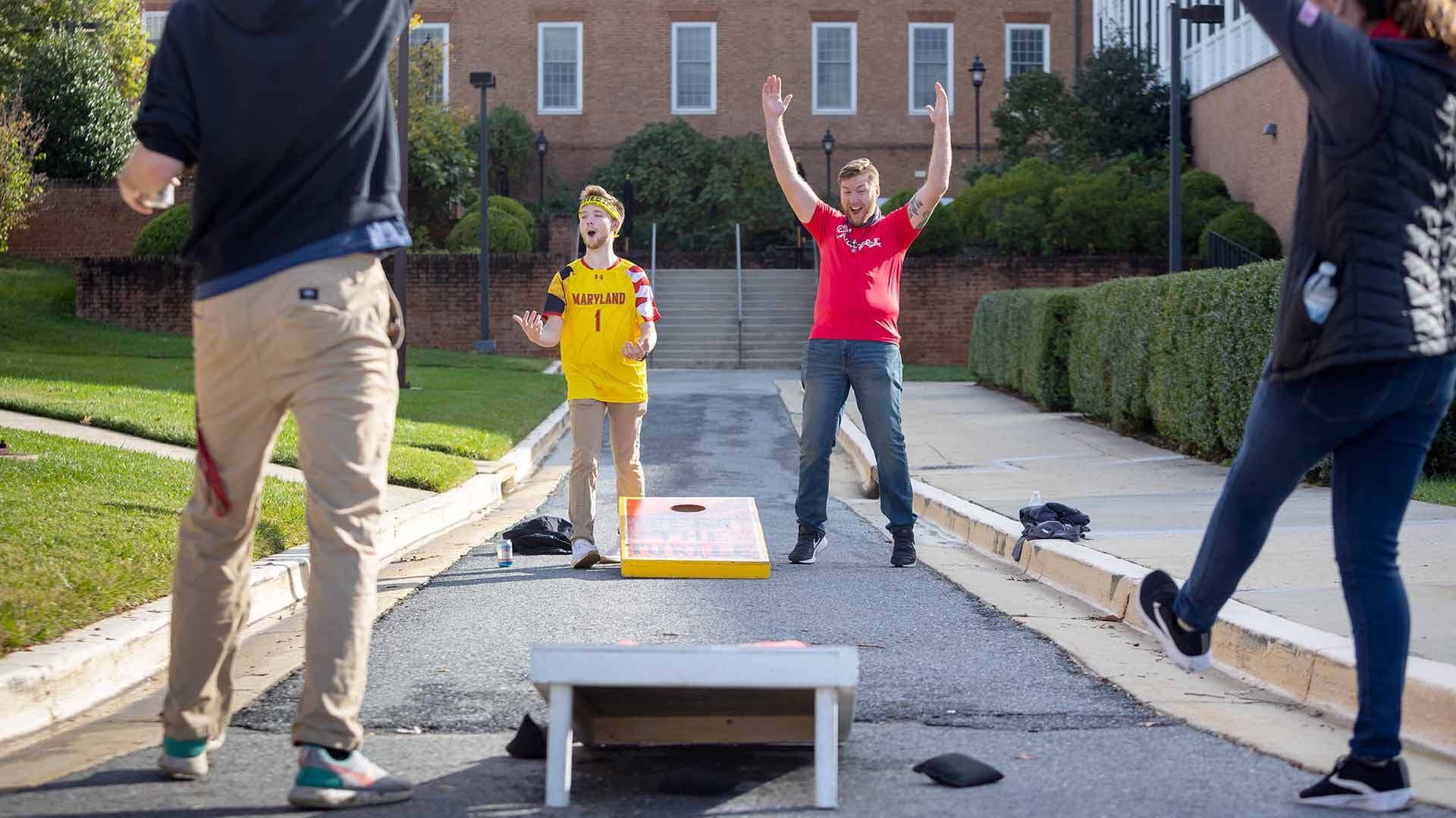 Terps play cornhole at tailgate