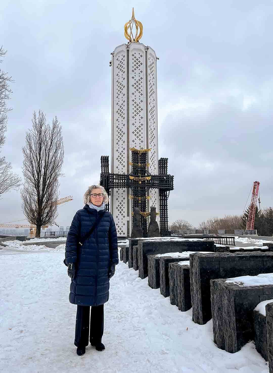 Larysa Kurylas ’80 stands by “Candle of Memory” at the National Holodomor Memorial Complex in Kyiv, Ukraine