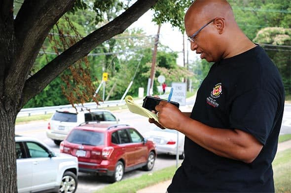 Sacoby Wilson works with students conducting local air monitoring in Langley Park, Md.