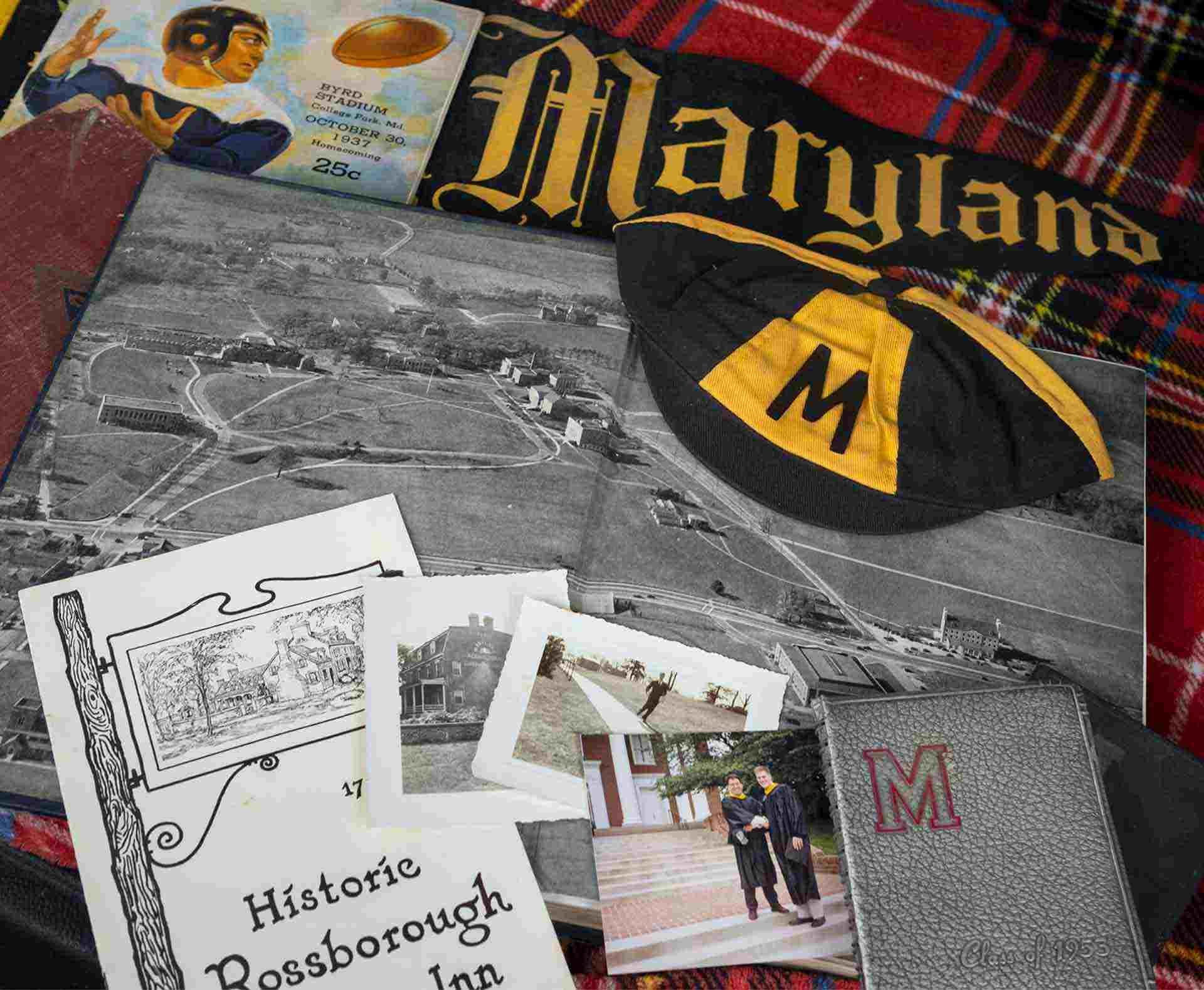 UMD memorabilia including yearbook, M Book, football program, beanie