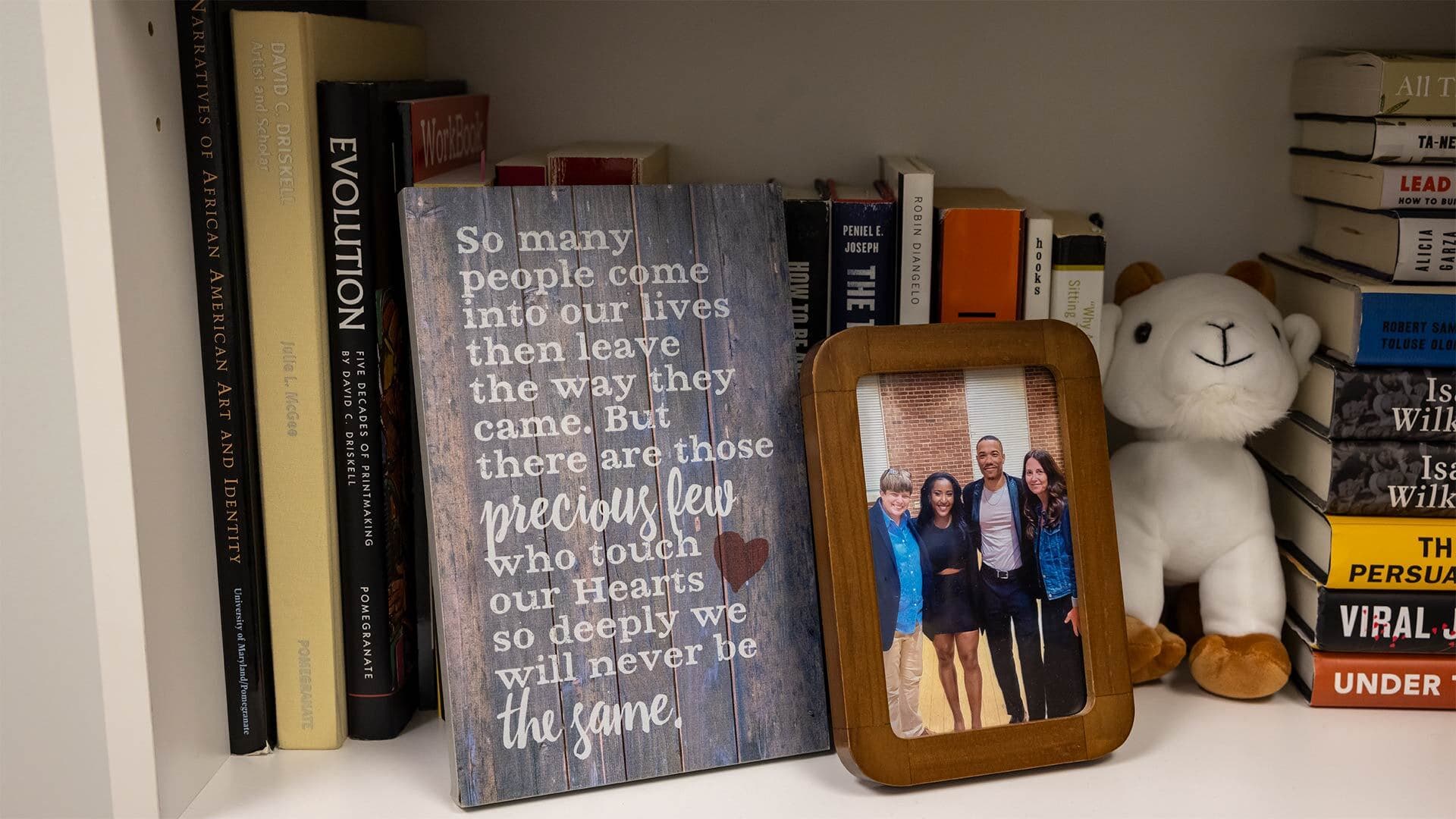 decoration with quote that reads, "So many people come into our lives then leave the way they came. But there are those precious few who touch our Hearts so deeply we will never be the same."