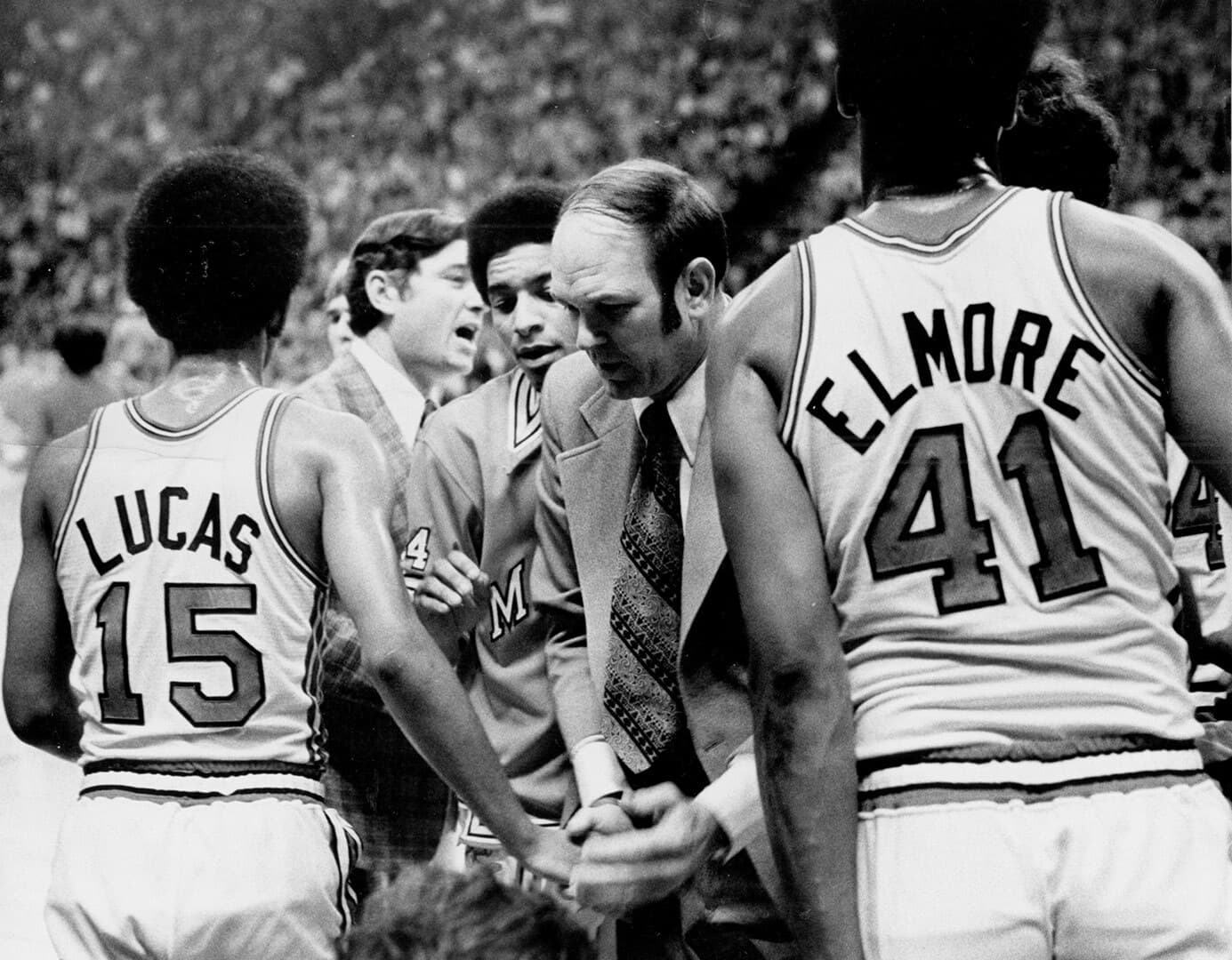Lefty Driesell Len Elmore and John Lucas during a basketball game 1975 1080