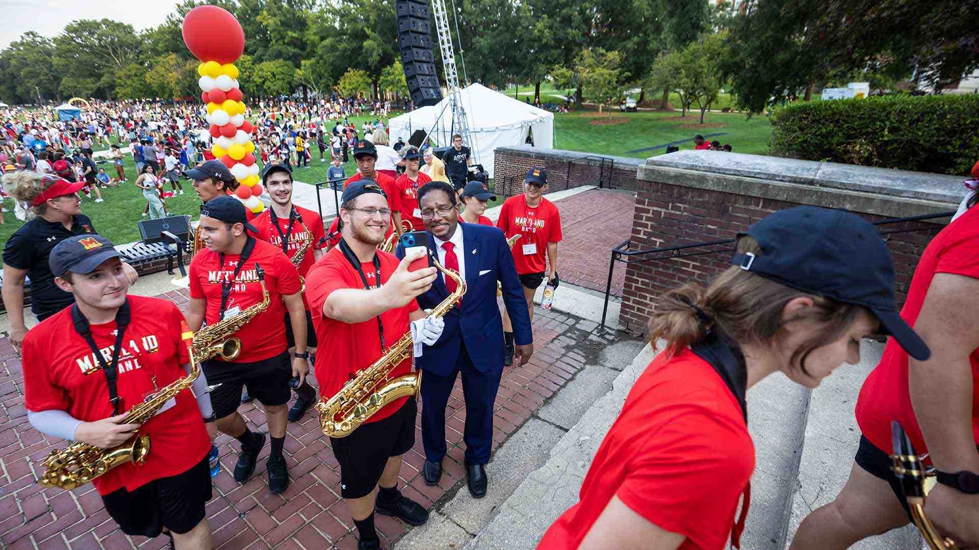 President Pines poses for selfie with Mighty Sound of Maryland member