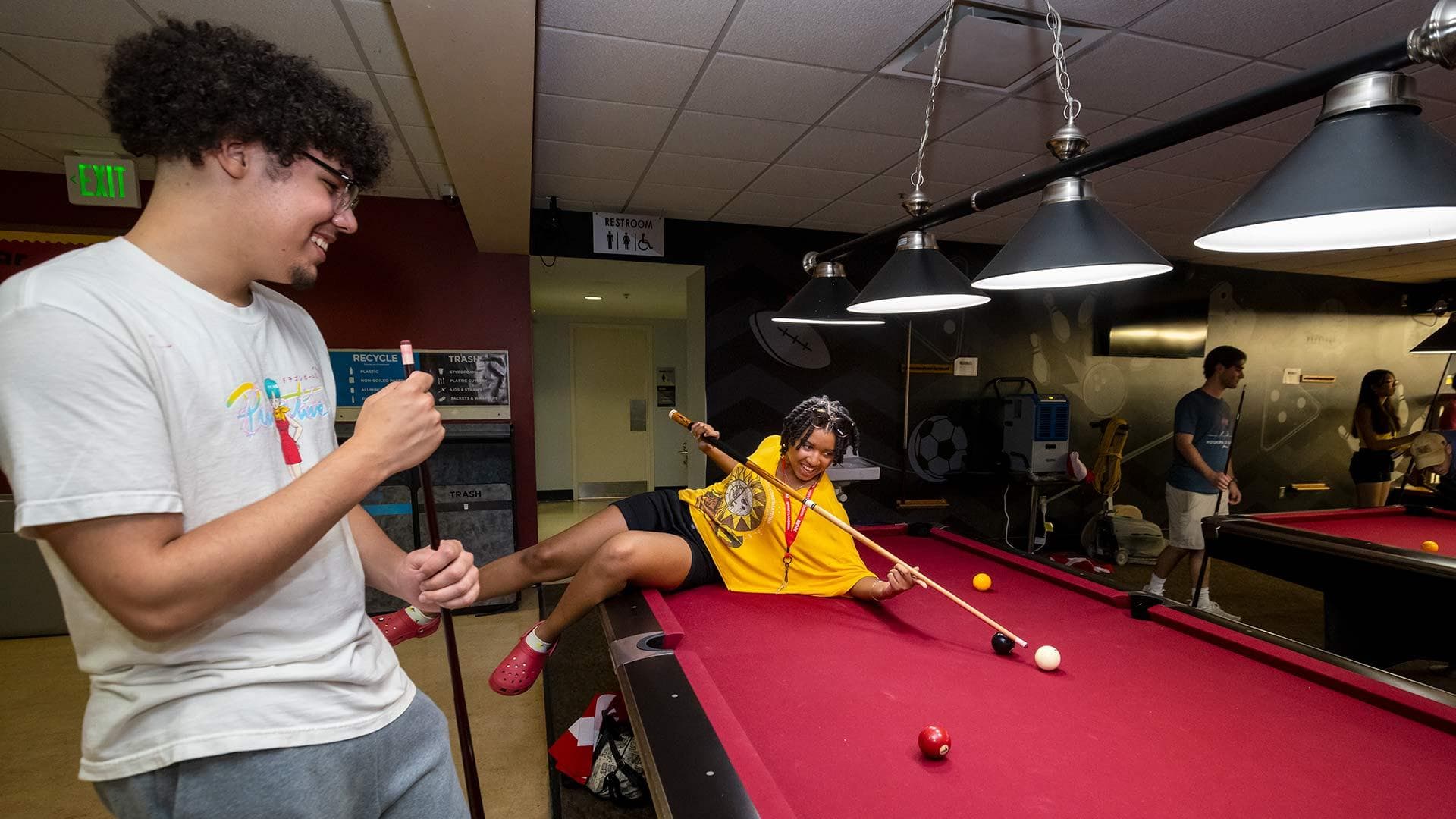 students play pool