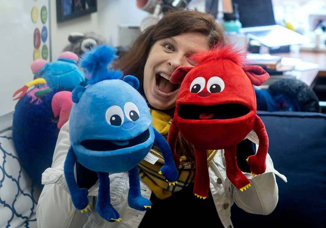 Robin Giebelhause with blue and red puppets