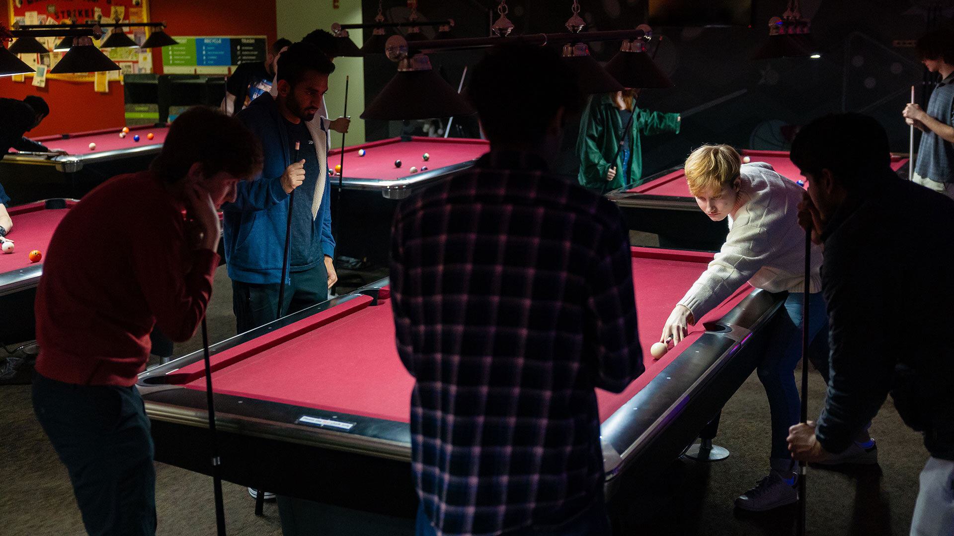 Students play billiards in TerpZone