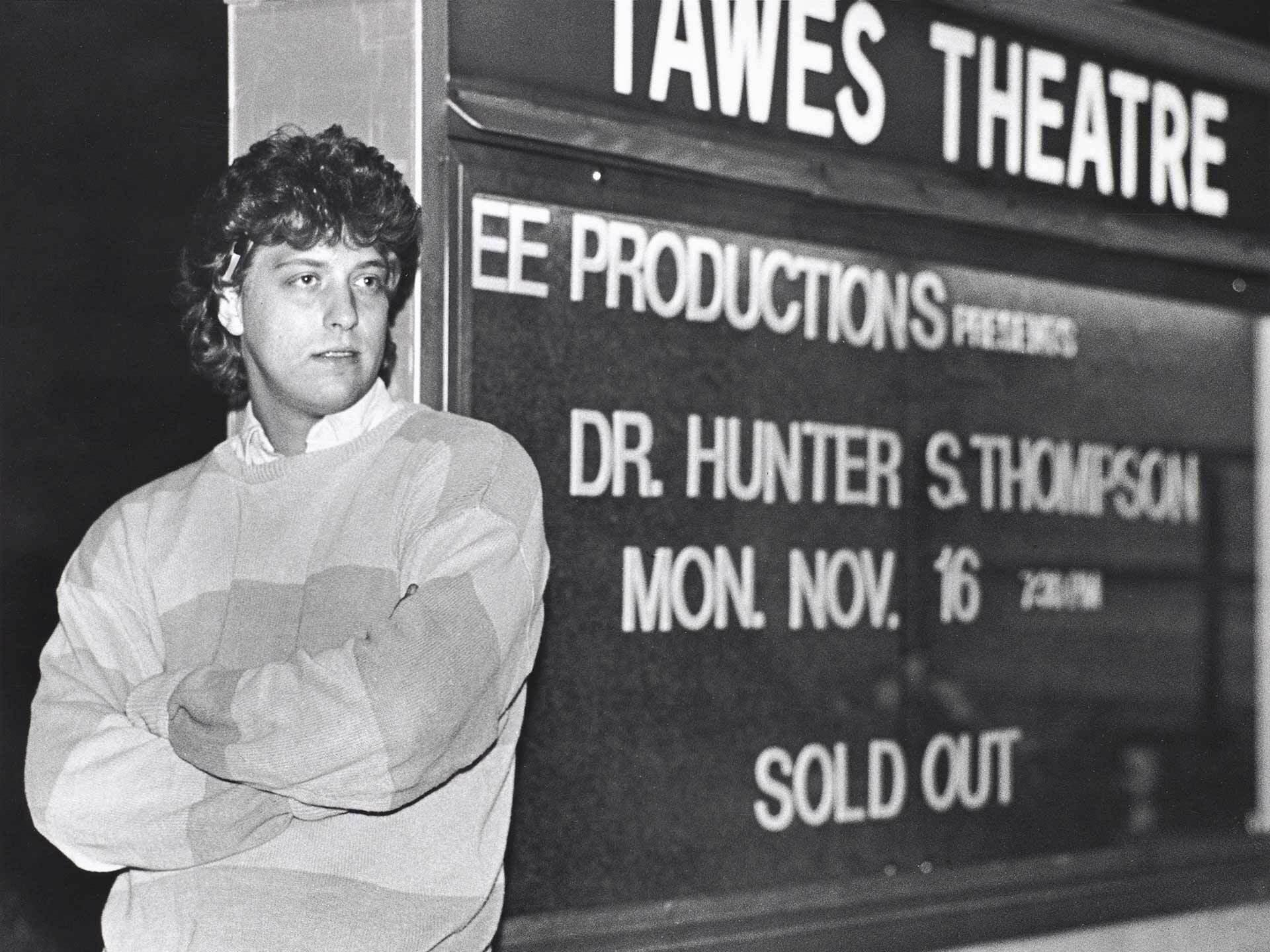 Hunter S. Thompson leans on marquee