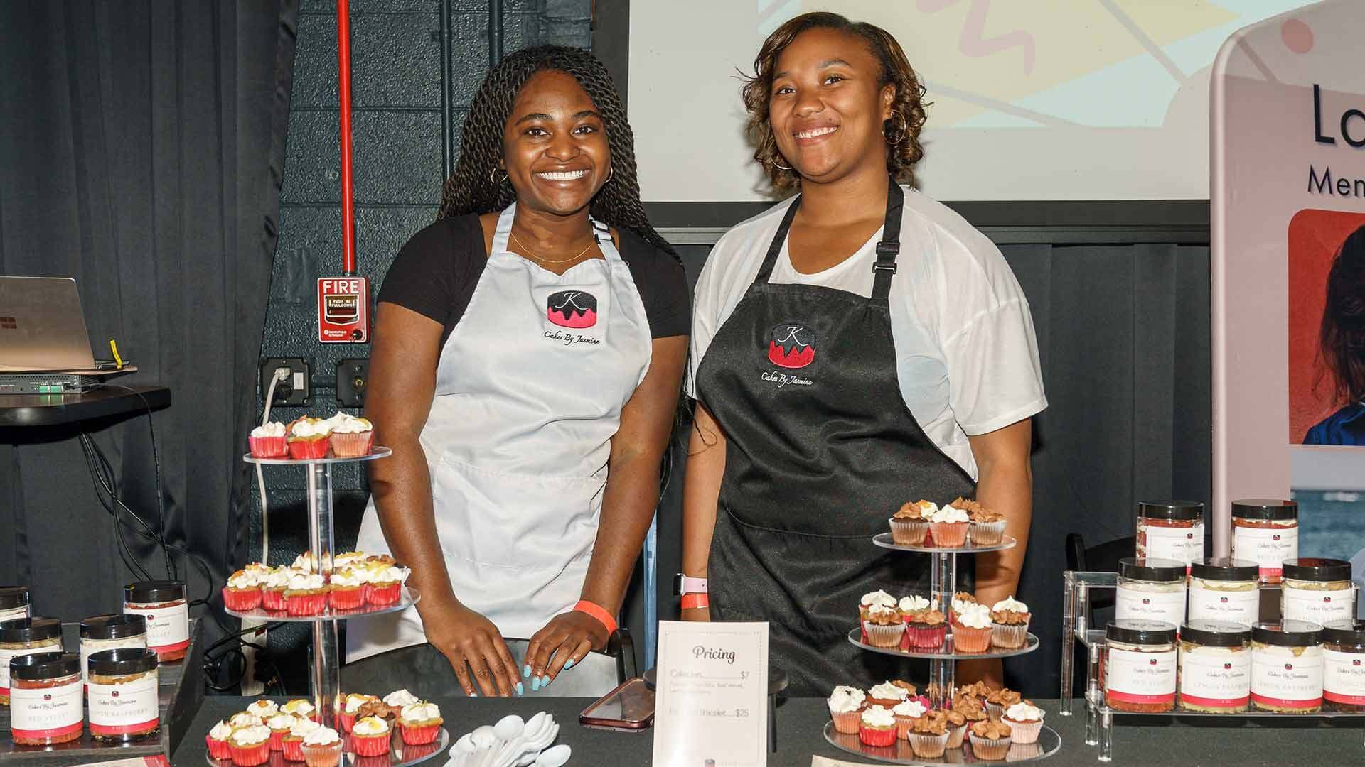 Two alums with cupcakes
