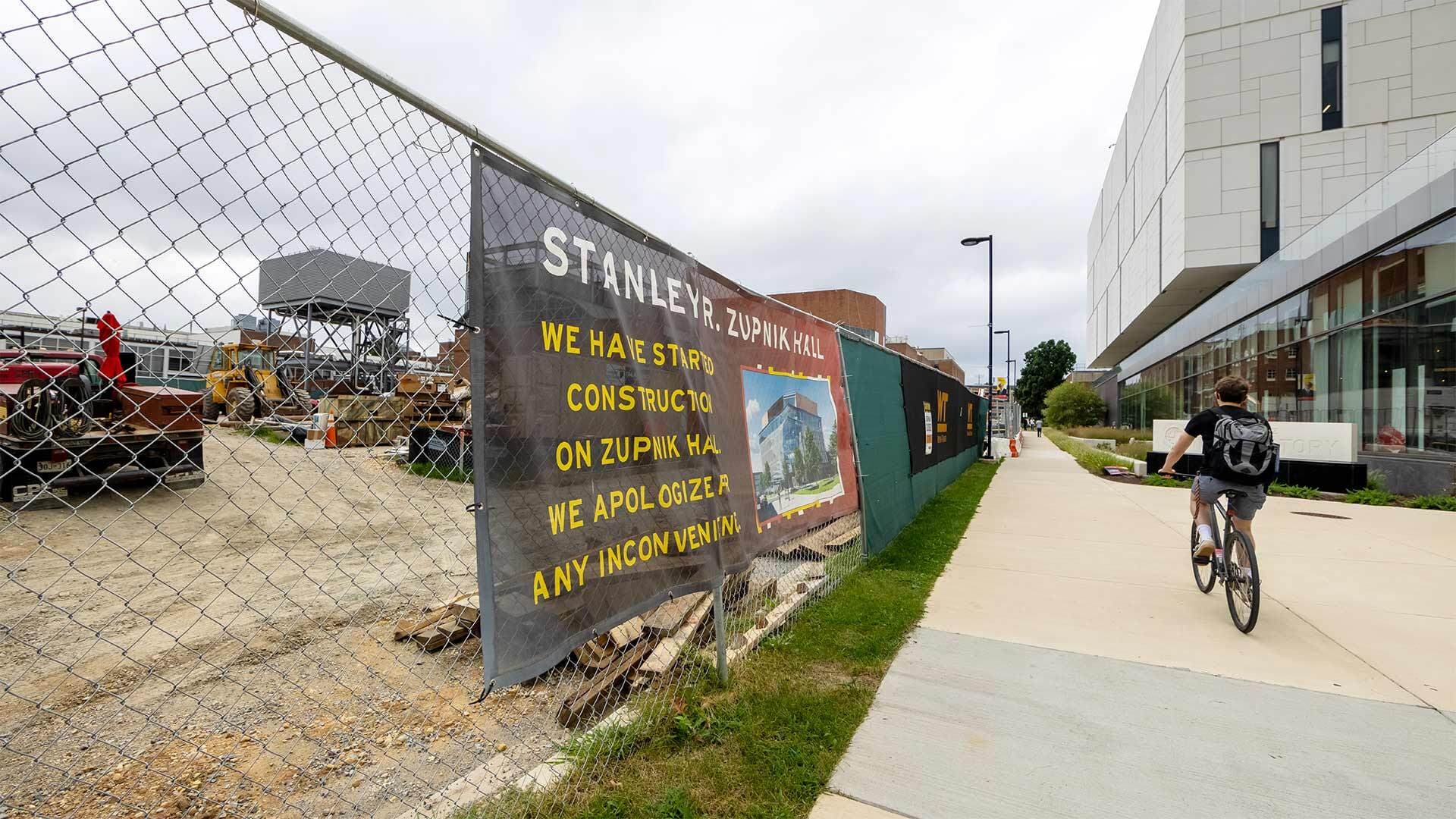 sign on fence for construction at Stanley R. Zupnik Hall