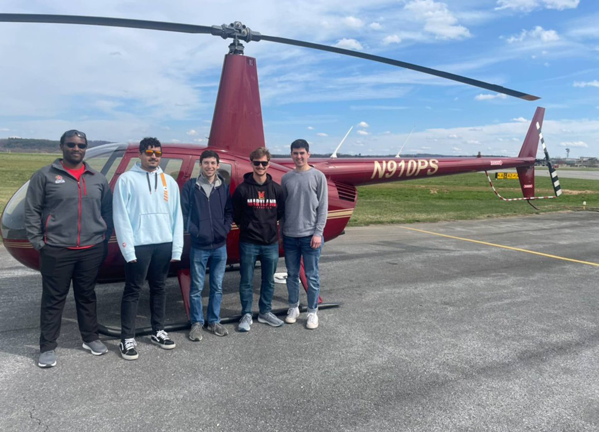 UMD Rotorcraft Center team poses by helicopter