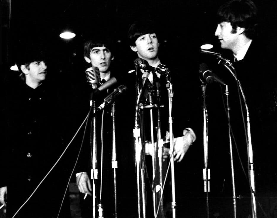 Black and white photo of the four members of the Beatles