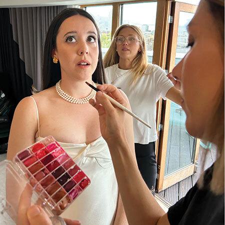 bride gets makeup done