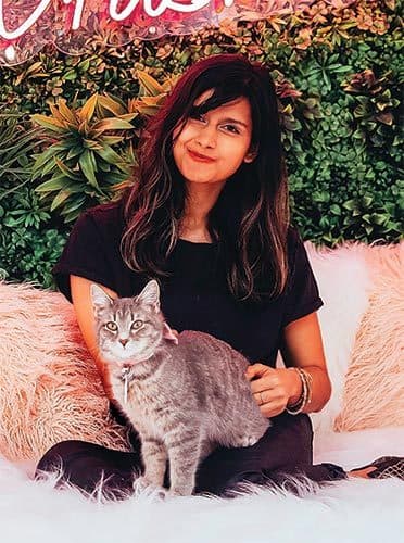 Kanchan Singh with a cat